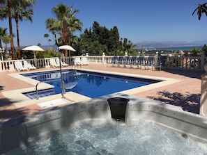 Jacuzzi, pool, and sea views