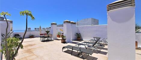 Fantastic private roof terrace with sun loungers and direct sea views