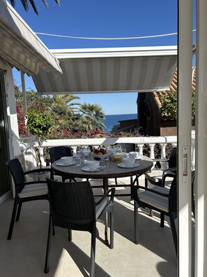 Dining Terrace with open fabric roof.