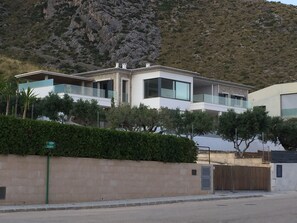 View from the private road of the villa with mountain backdrop