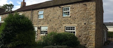 The front of the cottage which over looks the river and weardale railway.