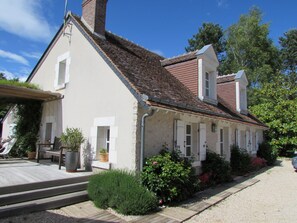 Main Facade and South-West Facade with Deck and Pool