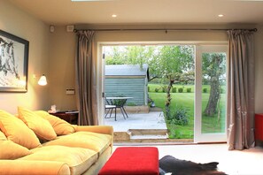 Sitting room with French windows onto the garden. 