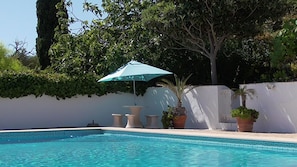 Poolside table - ideal for breakfast in the morning sun 