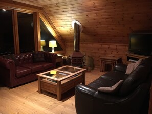 Quality sofas by the log fire
