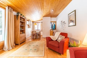 Living area with dining table in the background