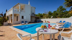 Sit or lounge by the pool at Casa Alimas