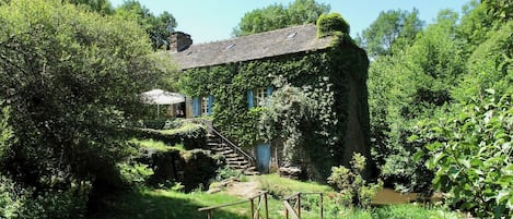 The mill viewed from the swimming pool, with the river to the right