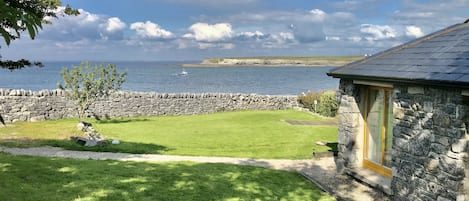 view of house and sea with Jerry the fisherman bringing back daily fresh fish