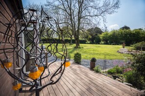 Enjoy the view from your patio across your private 3/4 acre garden.
