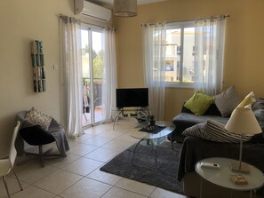 Patio doors lead onto large balcony