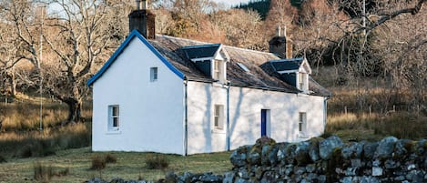 A winter view of Liddesdale Cottage from the loch-side.