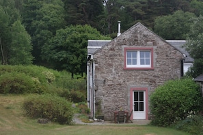 Garden door and upstairs sitting room window of Vorlich Cottage