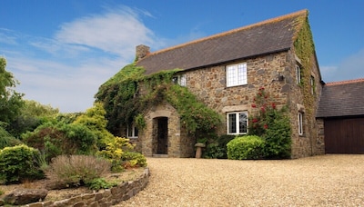 Stunning stone builtt house set in superb gardens close to the coast