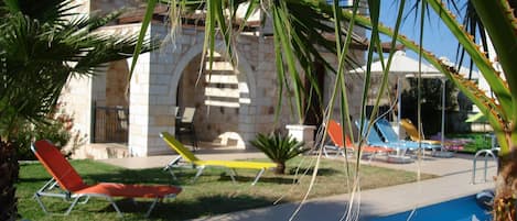 Green grass around the pool with plenty of Sun beds to Relax and enjoy the sun.