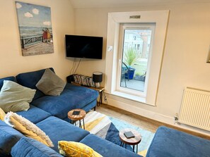 Enjoy sea glimpses from the sofa and roof terrace
