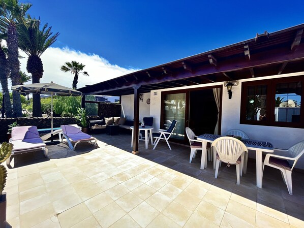 Large Patio at the front. Full sun all day with shaded area.