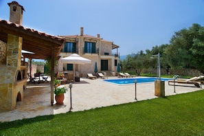 The Villa with its vast sunny terrace and the well tended lawn