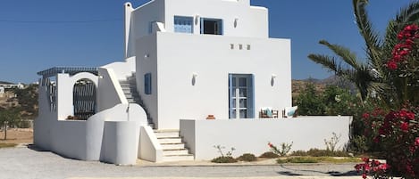 The front of the villa showing steps leading to the upper terrace 

