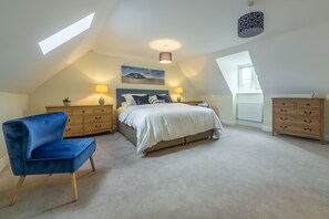 Silver Birches, Holt: Spacious master bedroom with super-king bed and vaulted ceiling