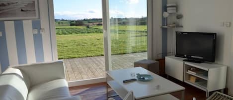 Living room, terrace and garden view