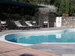 Outdoor shower is beside the pool