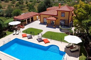 Pool, house and barbecue overview