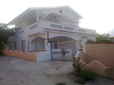 Sardinia, apartment in house with garden, facing the splendid beach of Foxi Manna