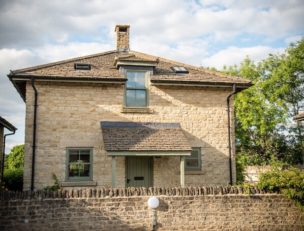 The front of the cottage, with adjacent parking