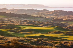 Royal Portrush Golf Course's famous seaside links is under a mile away. 