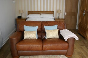 View of suite incorporating a soft leather Italian Sofa