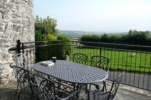 View from the raised terrace, overlooking the garden and out to the valley.