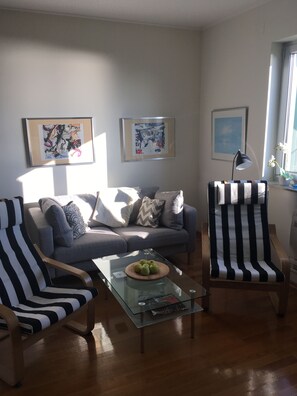 Open plan living room with exit to balcony