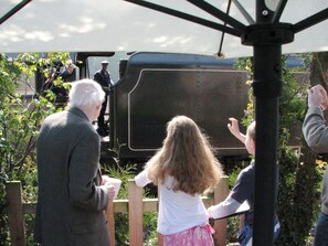 Waving at the trains from the patio at Railway Cottage