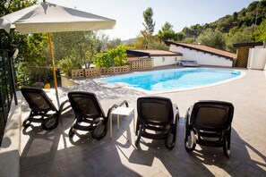 Terrace pool and lounge chairs