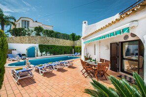 Swimming pool area with outside dinning area