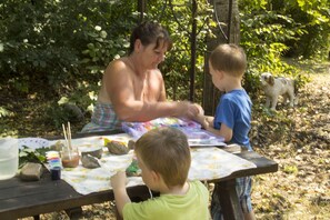 Kim doing some rock painting with some guests children
