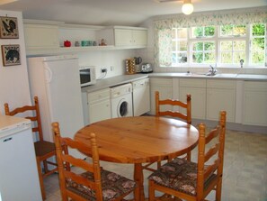 Kitchen with Dishwasher, Washing Machine and TV