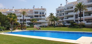 Main residence pool with parasols.