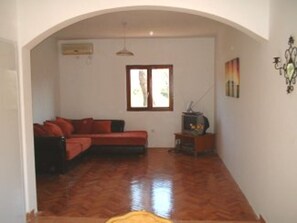 Ground floor living area, showing corner sofa bed