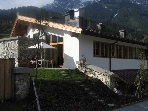 Summer view of apartment and patio area .