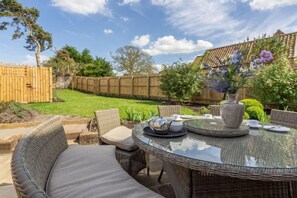 Ashdale, Thornham: Spacious patio area with seating for up to ten