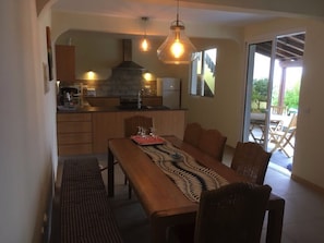 Kitchen leading to garden and pool