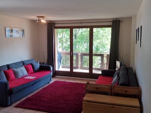 Lounge area looking out onto balcony.