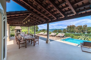 Large roofed patio with the sea view