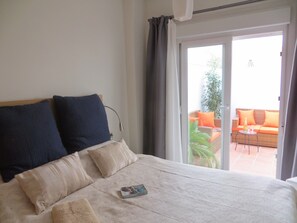 Bedroom with king-size bed (150 X 200cm) and doors to terrace
