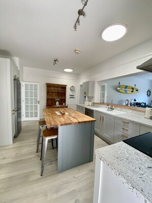 Fantastic new kitchen with island seating and doors to front living room 