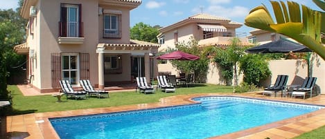 view from garden across the pool area