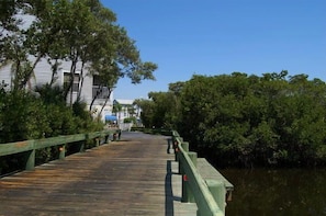 Across the wooden bridge and water to vacation property. 