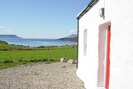 Front of cottage with view to Eigg